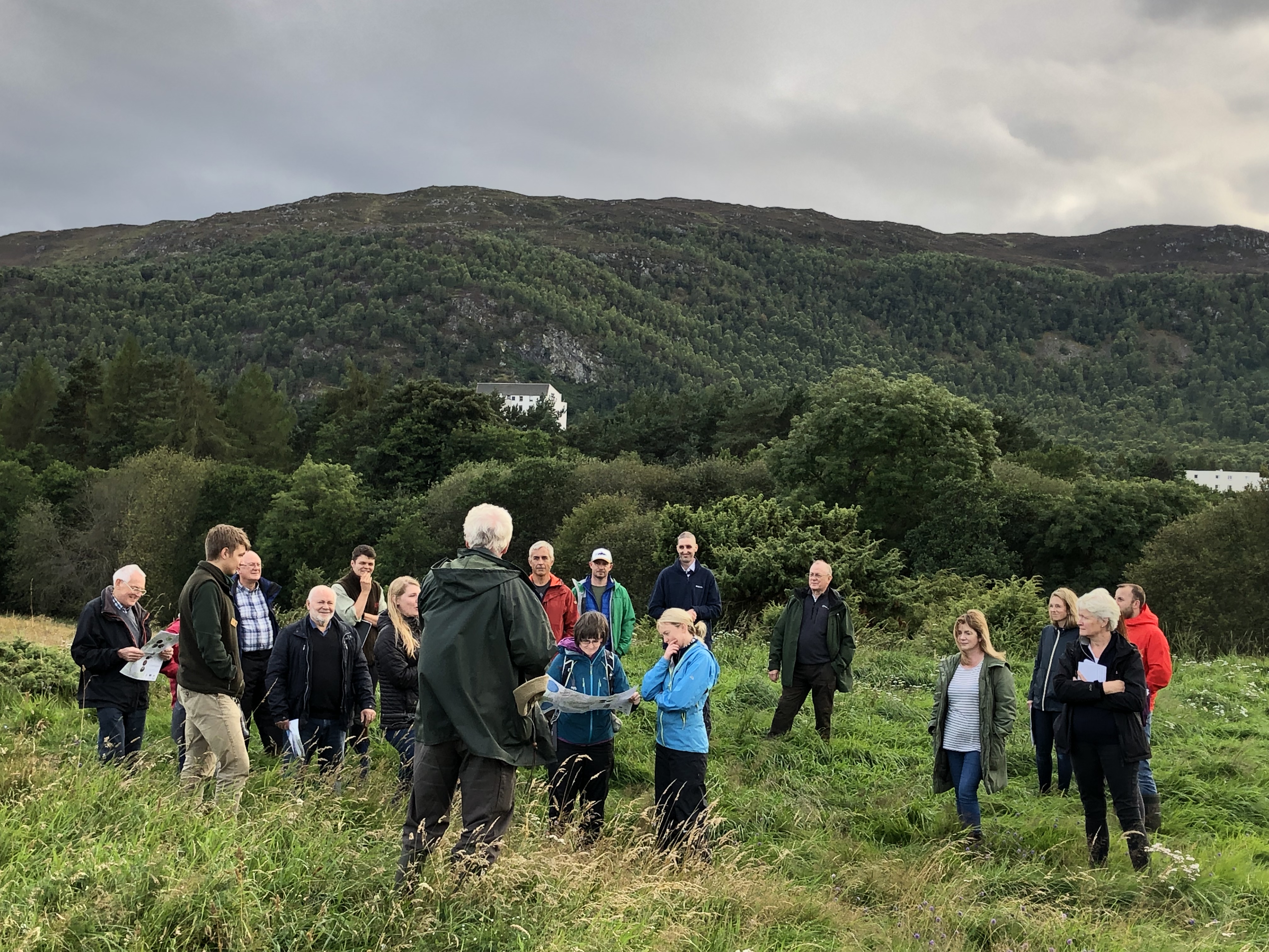 People interested in An Camas Mòr on a tour of the site